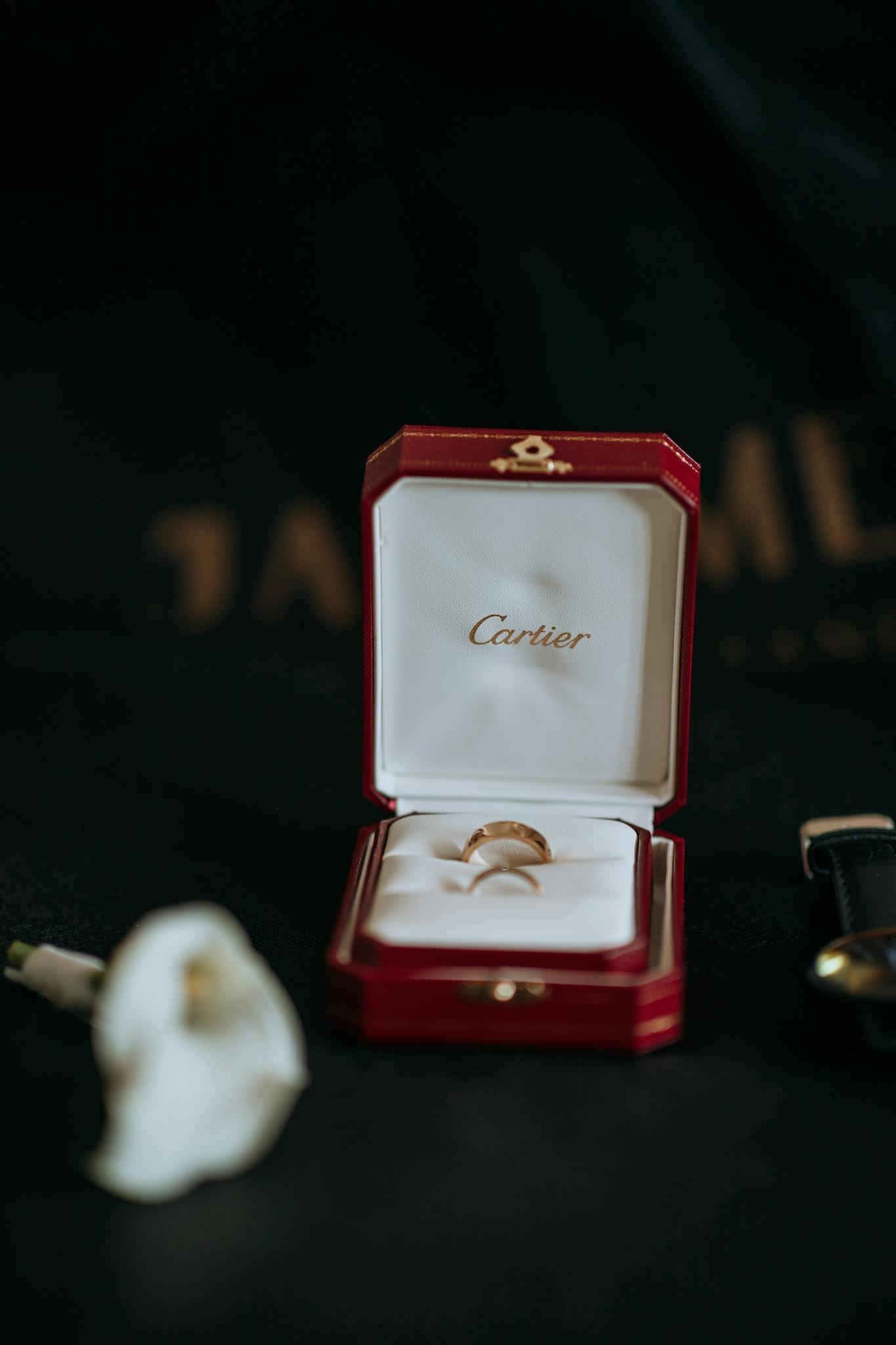 An elegant engagement ring displayed in a luxurious Cartier jewelry box, perfect for special occasions.