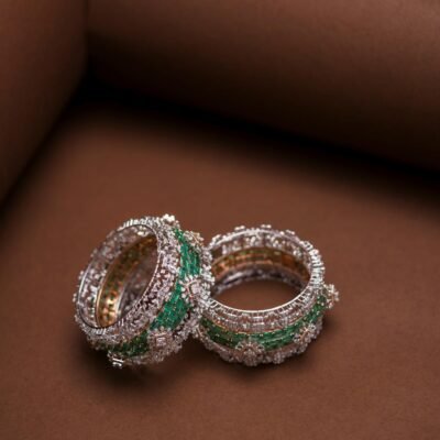 Close-up of Indian Swarovski crystal bangles on a brown backdrop, highlighting intricate design.