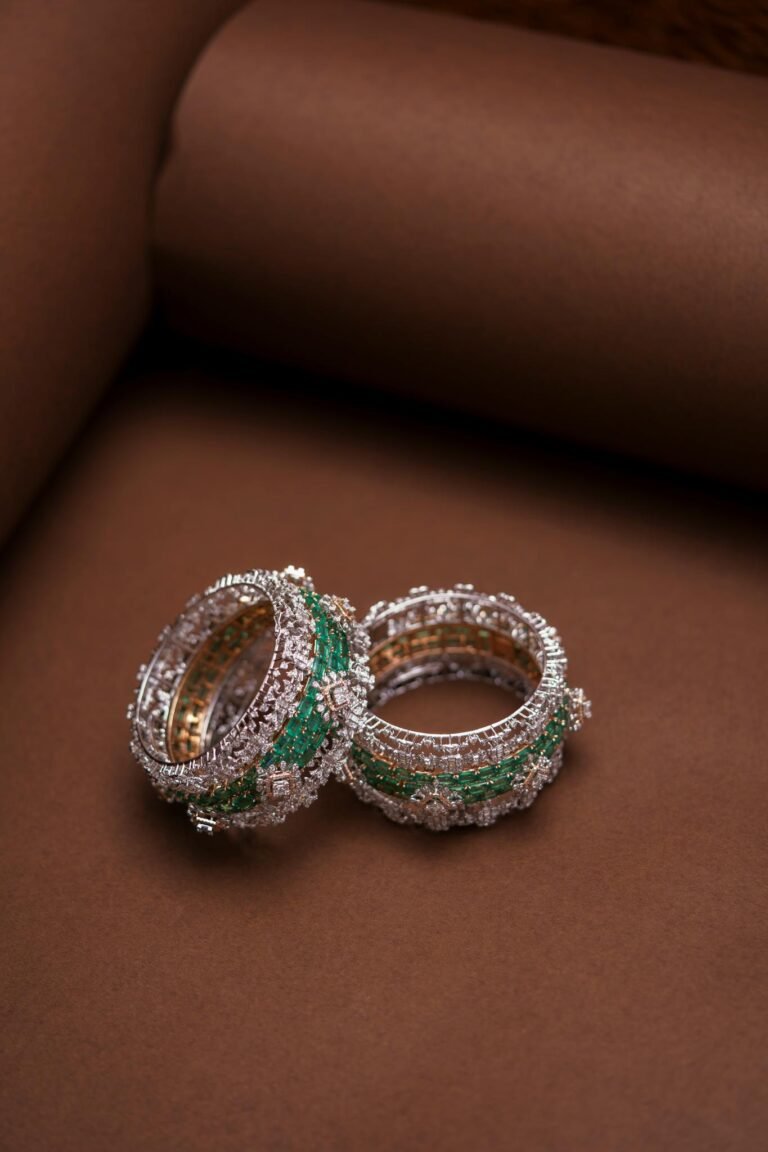 Close-up of Indian Swarovski crystal bangles on a brown backdrop, highlighting intricate design.